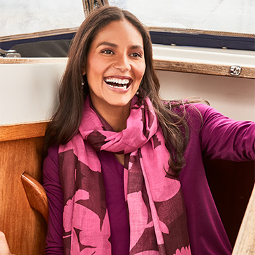 Woman in vibrantly colored shirt and scarf