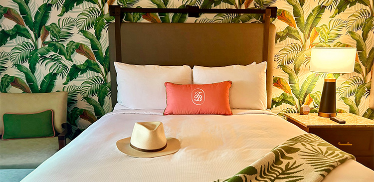 image of bed in room at Tommy Bahama Miramonte Resort & Spa