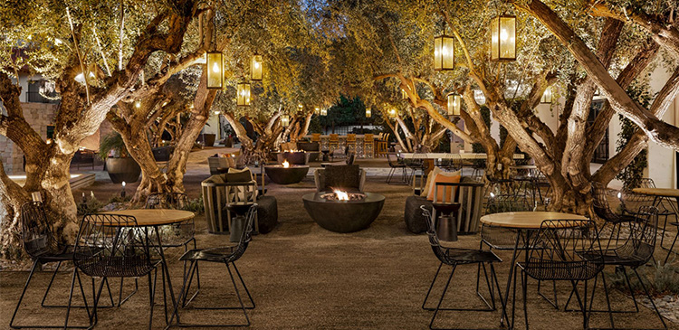 nighttime image of outdoor seating at Tommy Bahama Miramonte Resort & Spa