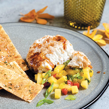 Macadamia-crusted goat cheese with mango salsa